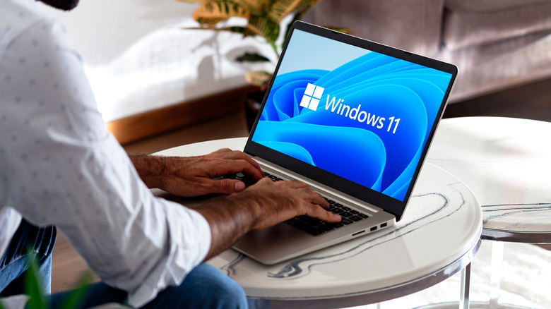 A man using a Windows 11 computer
