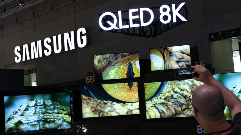 A display of Samsung QLED TVs.
