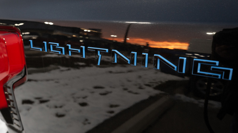 Ford F-150 Lightning logo on the tailgate of the truck.