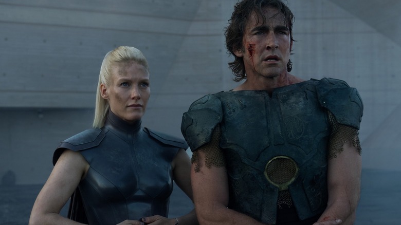 A scene of season 2 of Apple TV's Foundation showing a man and a woman in fighting outfit