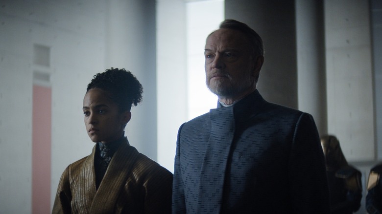 A season 1 scene of Apple TV Foundation showing a woman and a man
