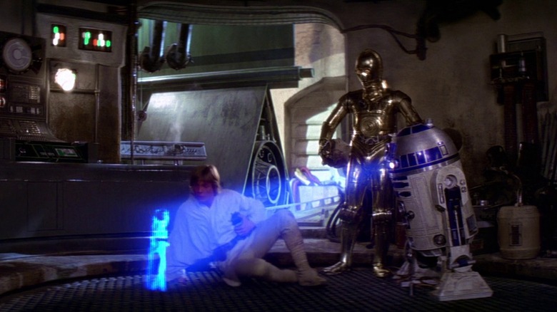 Princess Leia's hologram image projects on floor from R2D2