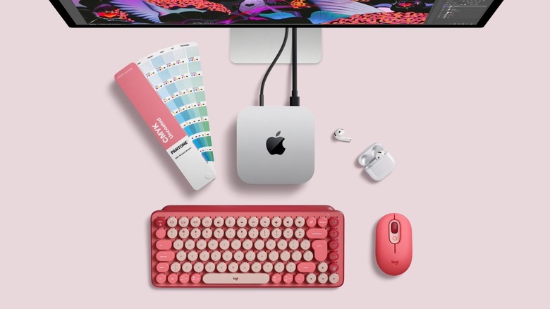 A Mac mini in a pink desktop setup