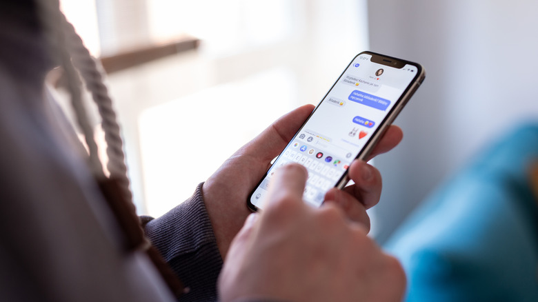 A person using iMessage on an iPhone