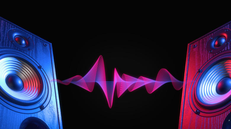 Two speakers on black background with visual representing audio between the two