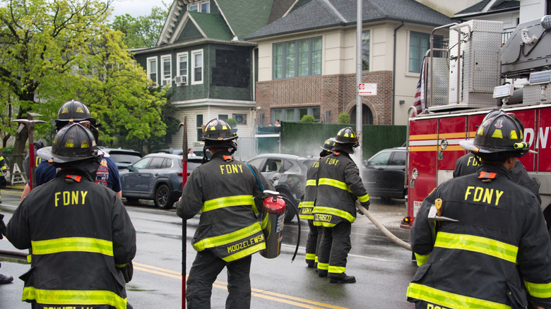 Firefighters responding to a car fire.