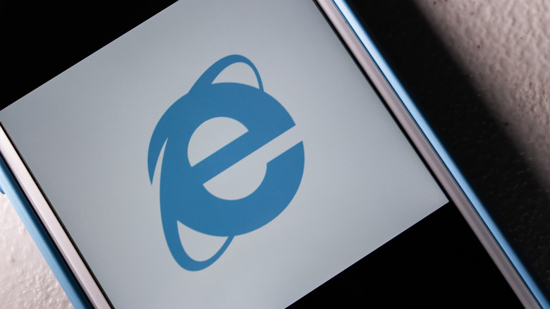 Internet Explorer logo over a white background on a smartphone screen.