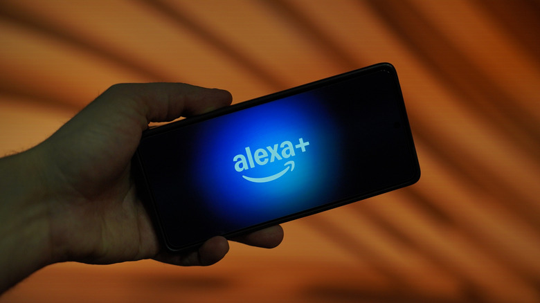 Image showing a phone with an Alexa+ logo flashing on screen.