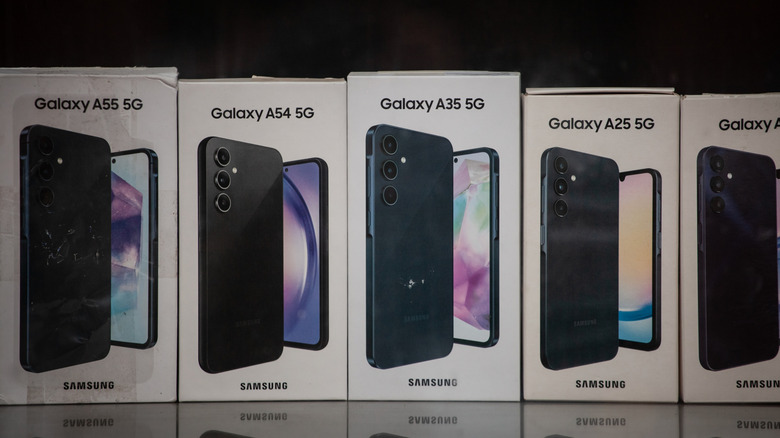 Five Samsung Galaxy A series phones in a row in their boxes.