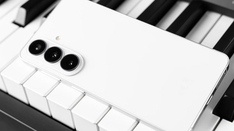 The base Galaxy S26 placed on a piano.
