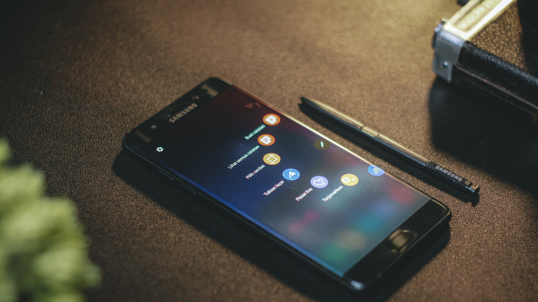 A Samsung Galaxy smartphone with a stylus pen