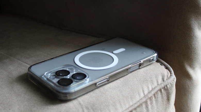 A MagSafe-compatible iPhone case sitting on a cushioned chair.