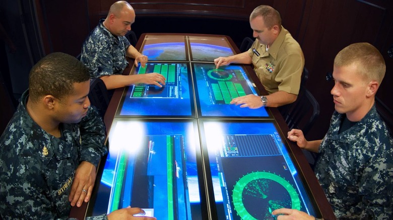 Naval officers testing touchscreen tables for Virginia-class submarine