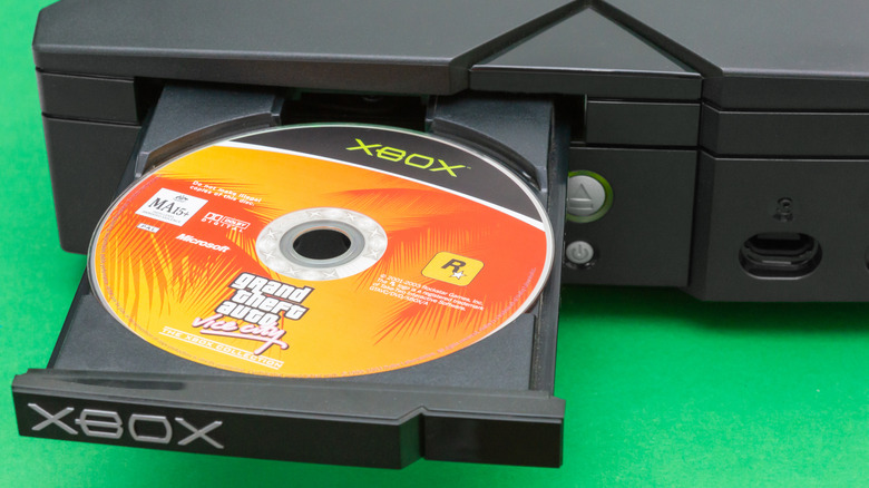 A copy of Grand Theft Auto Vice City in an Xbox disc tray.
