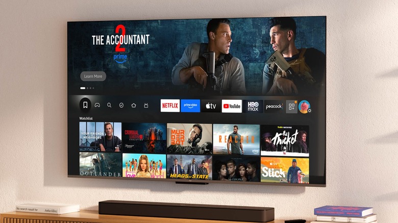 Amazon Fire TV on wall displaying various apps and shows