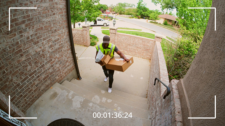 A package being delivered to a home as seen on a home security camera