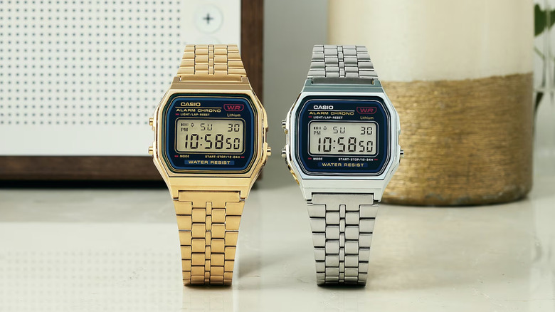 Two Casio A159 watches, one in gold and one in silver, displayed side by side.