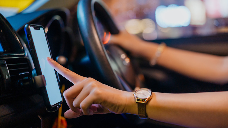 An Uber driver using a smartphone