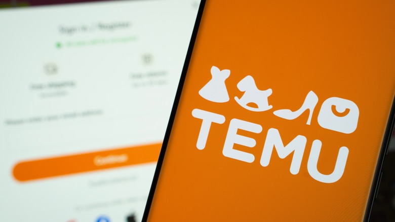 Temu app open on a smartphone with its website in the background