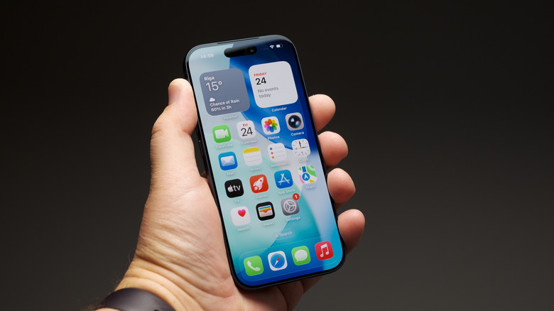 A hand holding an iPhone 17 Pro.