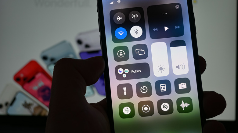 An iPhone's Control Center showing the brightness set at maximum.
