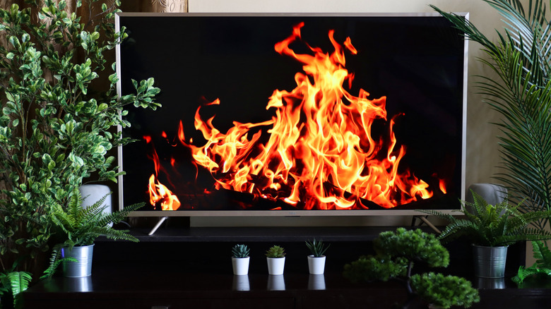 An OLED TV displaying an image of fire