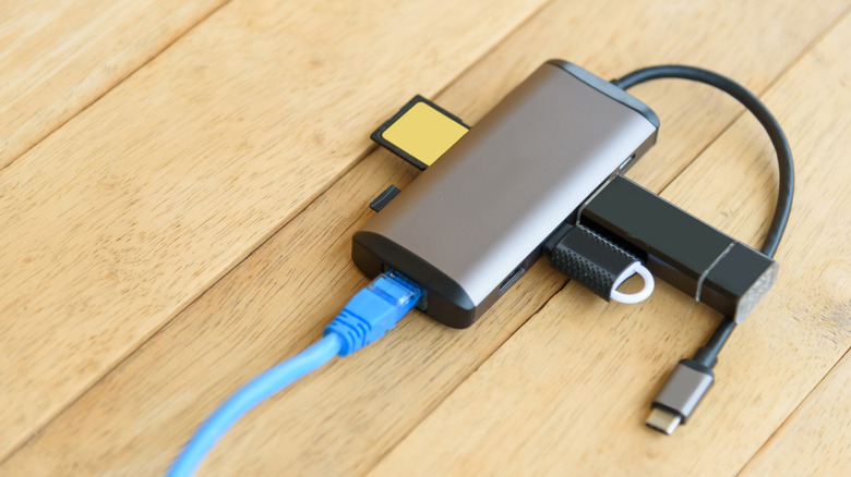 A USB-C hub with various cables connected.