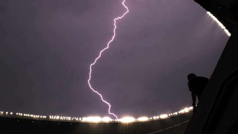 A bolt of lightning flashes through the sky.
