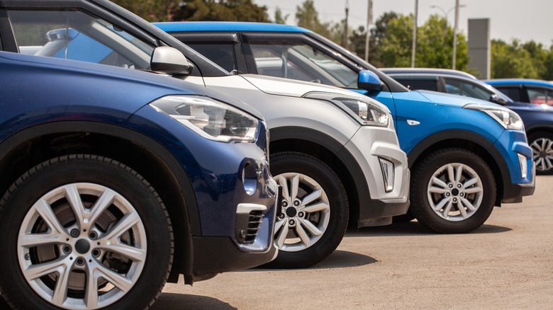 Electric vehicles lined up in a parking lot