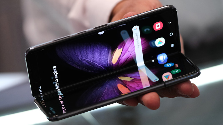 A stand host displays the new Samsung Galaxy Fold smartphone at the 2019 IFA