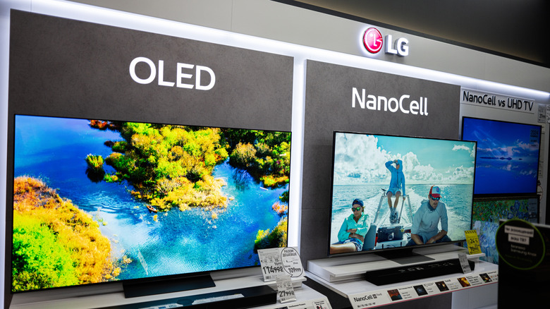 OLED and NanoCell TVs on display in store with price tags visible in front
