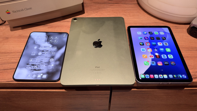 iPhone Duo screen up, iPad Air screen down, and iPad mini screen up all on a desk
