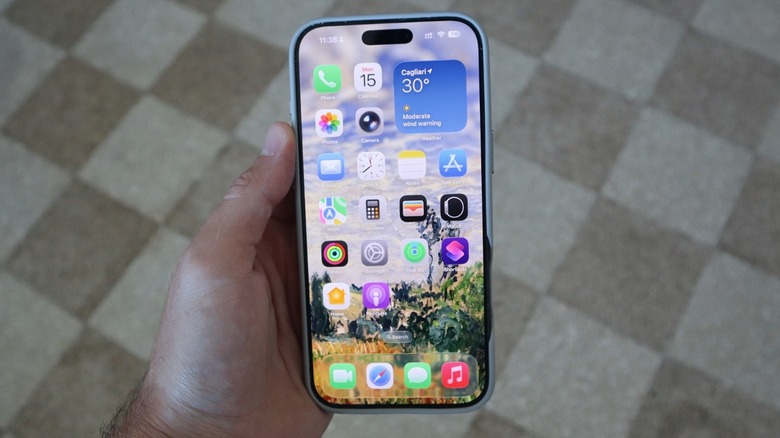 A hand holding an iPhone