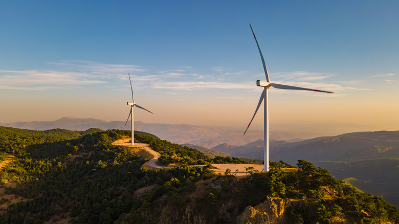An image of a wind farm in a mountainous region.