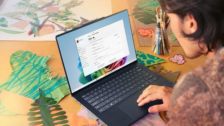 Man checking Settings in Windows laptop