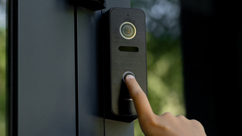 Finger pushing video doorbell