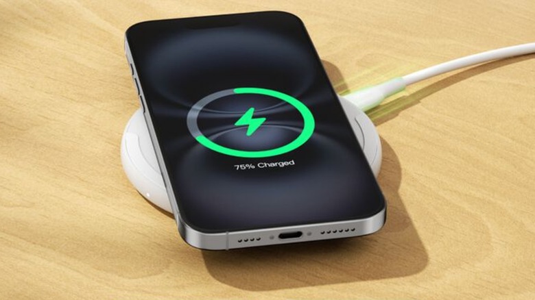 iPhone charging on a Belkin wireless charging pad