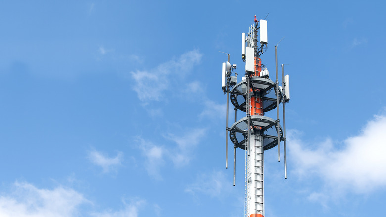 a cell tower against a sky backdrop