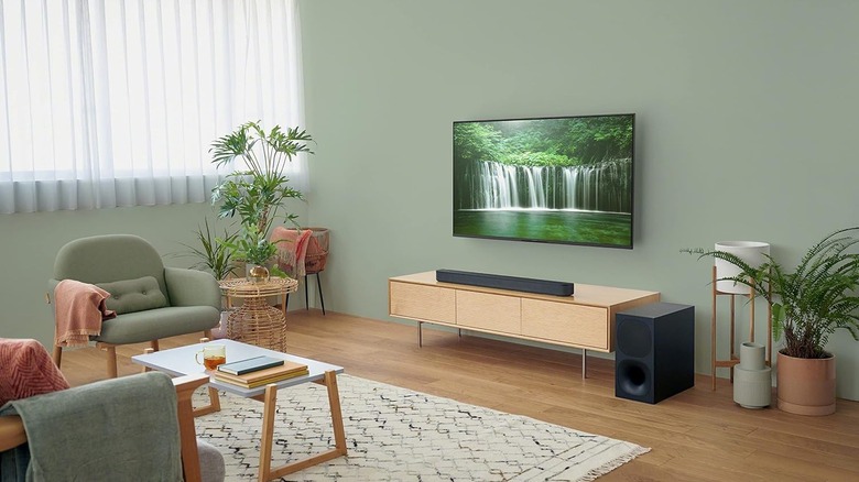 The Sony HT-S400 placed below a wall-mounted TV in a modern living room.