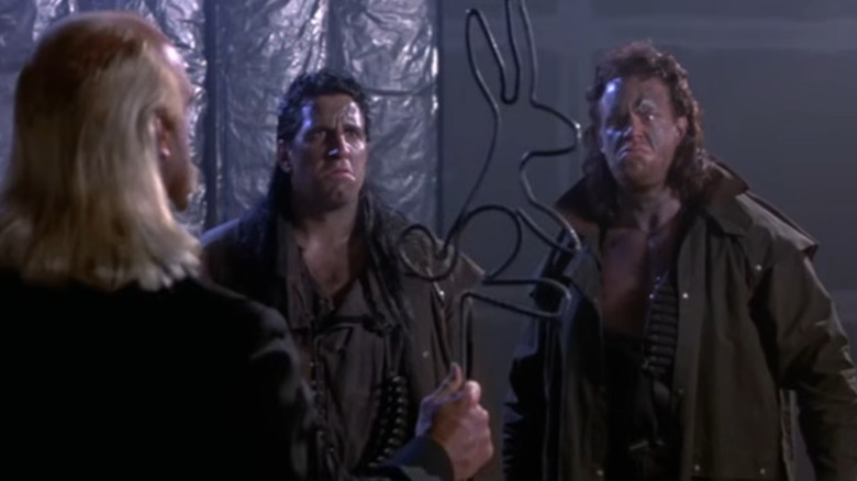 Mark Calaway, Undertaker, playing a bounty hunter, is presented a bunny rabbit made of rebar by Hulk Hogan's character
