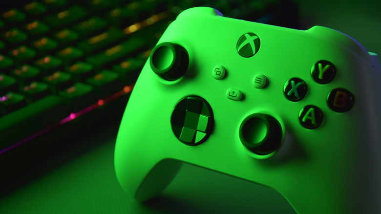 close-up of xbox controller and pc keyboard
