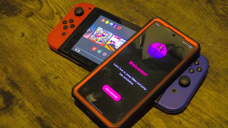 Eden emulator on Samsung Galaxy S25 resting atop Nintendo Switch.