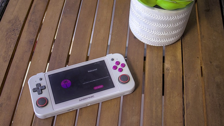 Anbernic RG505 handheld with Eden emulator welcome menu on screen.