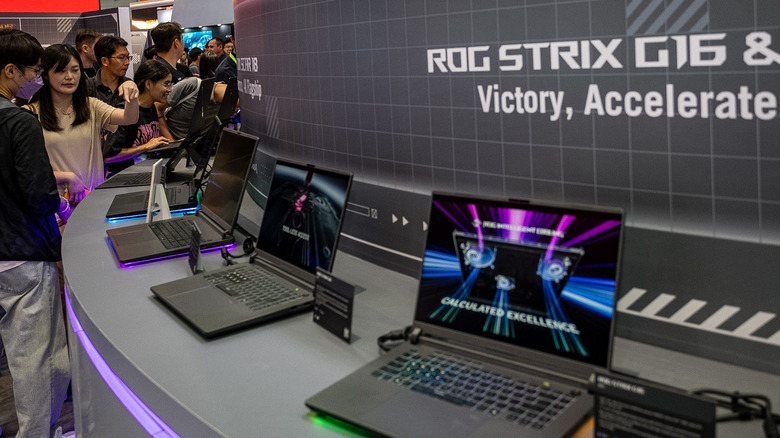 Asus's Republic of Gamers lineup of high-performance laptops on display at a trade convention.