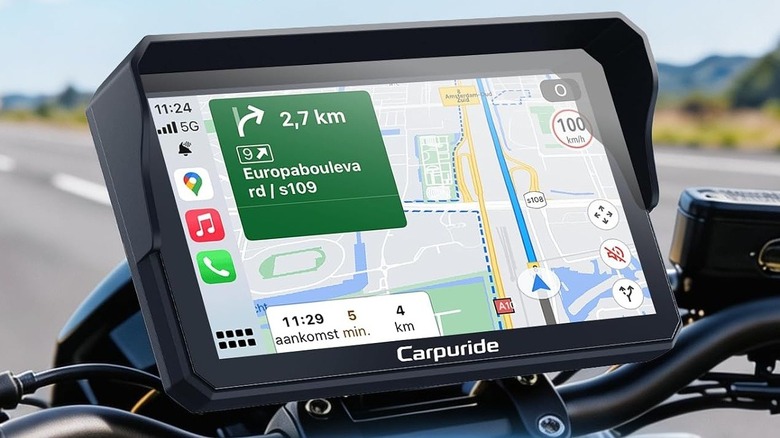 Close-up of a Carpuride Android Auto head unit on a motorcycle
