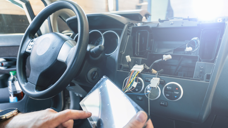 Car stereo being installed