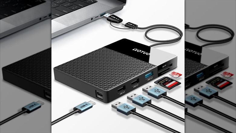 Yotuo Multi-Functional External Hard Drive placed on a desk with multiple USB connectors on the side