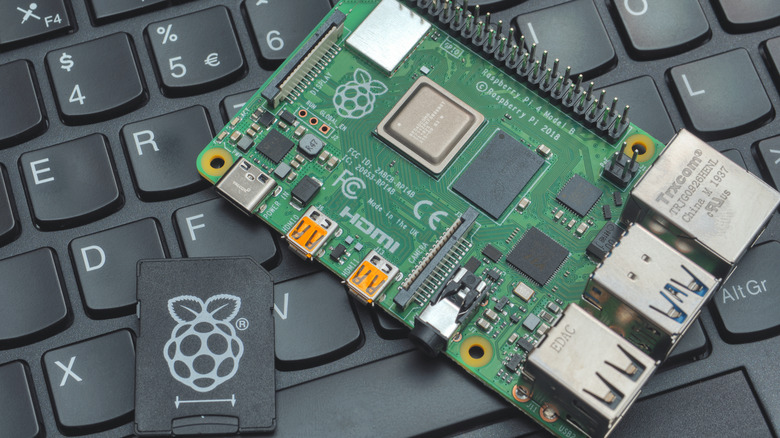 Image of a Raspberry Pi and SD card sitting on a laptop keyboard