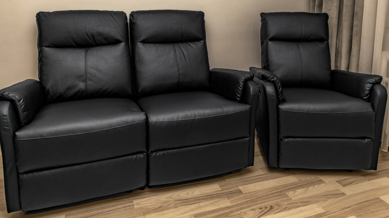 A sofa recliner and single recliner next to each other.