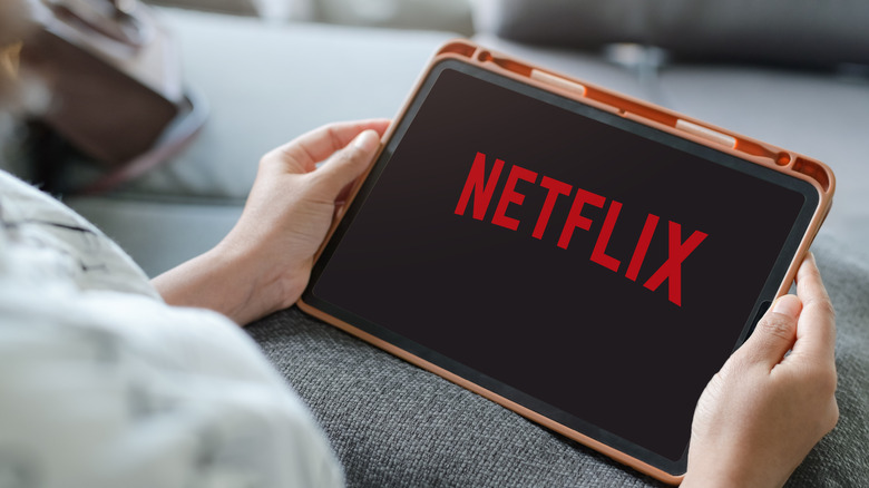 Person watching Netflix on a tablet